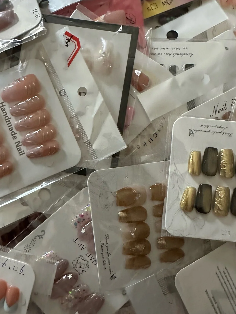 100 Sets of SURPRISE Assorted Press-On Nail Sets - Floral, Pink, Blue, Neutral